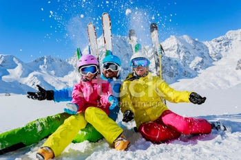 Family enjoying winter ski vacation