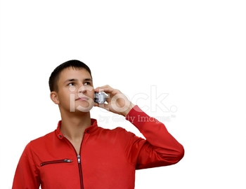 Attractive young man holding out cellphone.